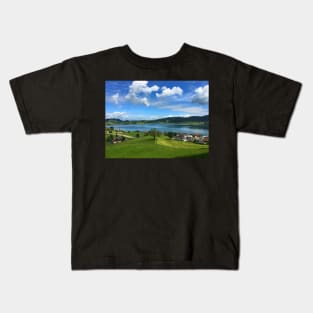 View on a lake and village in Switzerland Kids T-Shirt